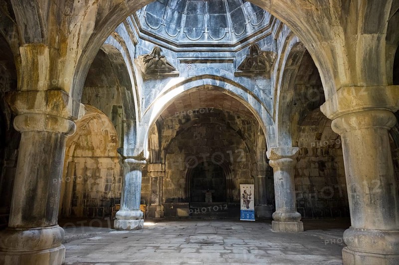 Historic interior with arched stone arches, through which rays of light create a mystical atmosphere, Haghpat Monastery, Haghpat Town, UNESCO World Heritage Site, Lorikeet Province, Armenia