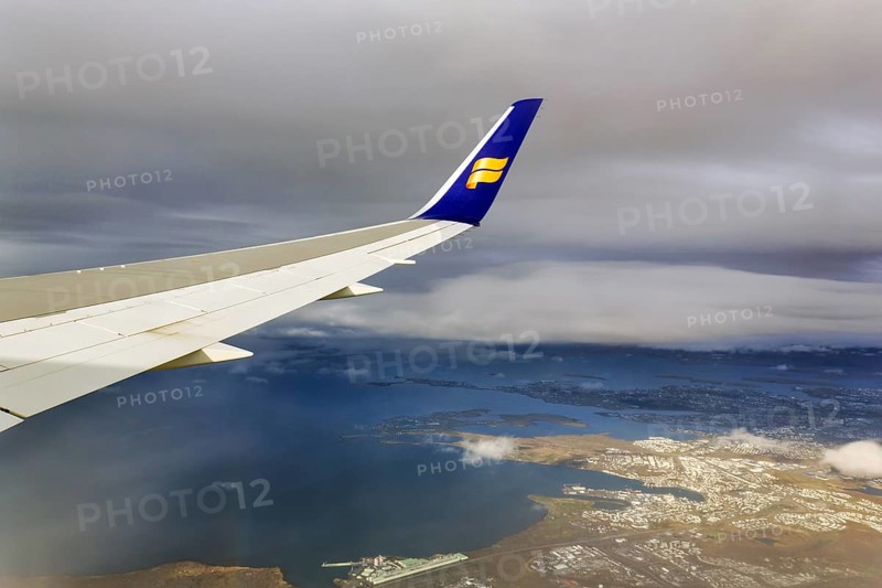 Wing, airplane, Icelandair airline logo, flying to Boston, view of Reykjavik, aerial view, Iceland