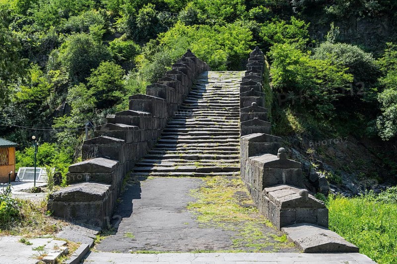 Historic stone staircase leads through a wooded landscape covered with moss, bridge, Sanahin bridge over the Debed river, Alaverdi, Alaverdi, Lorikeet province, Armenia
