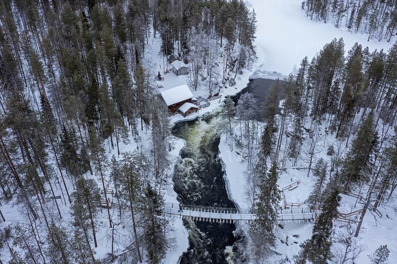 Aerial view over Myllykoski water mill along the river Kitkajoki in winter, Oulanka National Park, Northern Ostrobothnia / Norra Ã–sterbotten, Finland