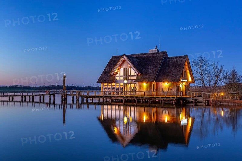 LakehouseÂ°54, bistro and bar on Lake Hemmelsdorf / Hemmelsdorfer See at sunrise in spring near LÃ¼beck, Schleswig-Holstein, Germany