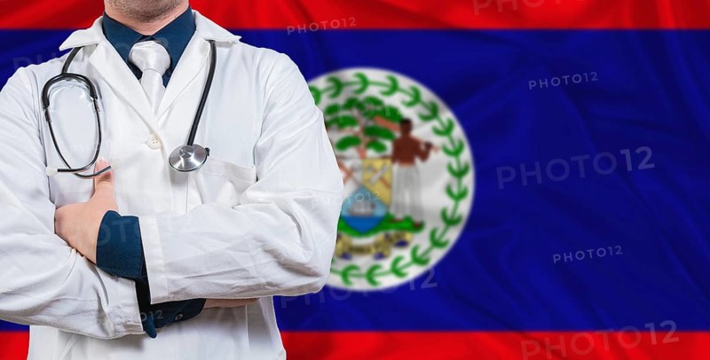 Male doctor with stethoscope on Belize flag. Doctor holding stethoscope on Belize flag