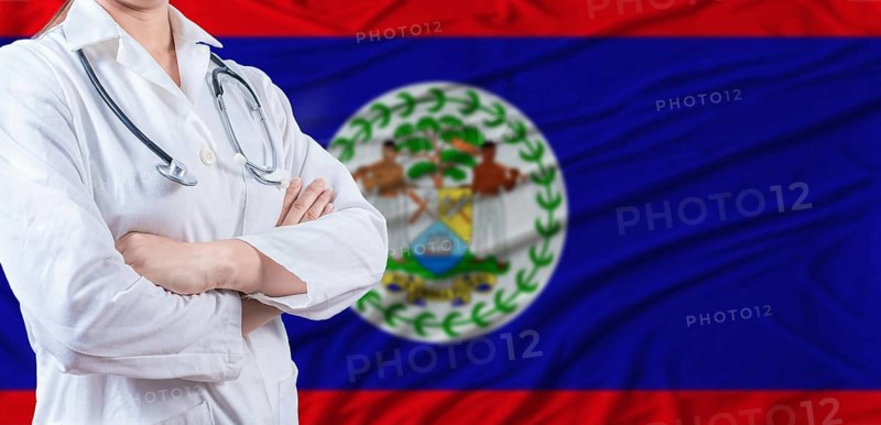 Doctor with crossed arms on Belize flag. Belizean health and care concept. Female doctor on Belize flag