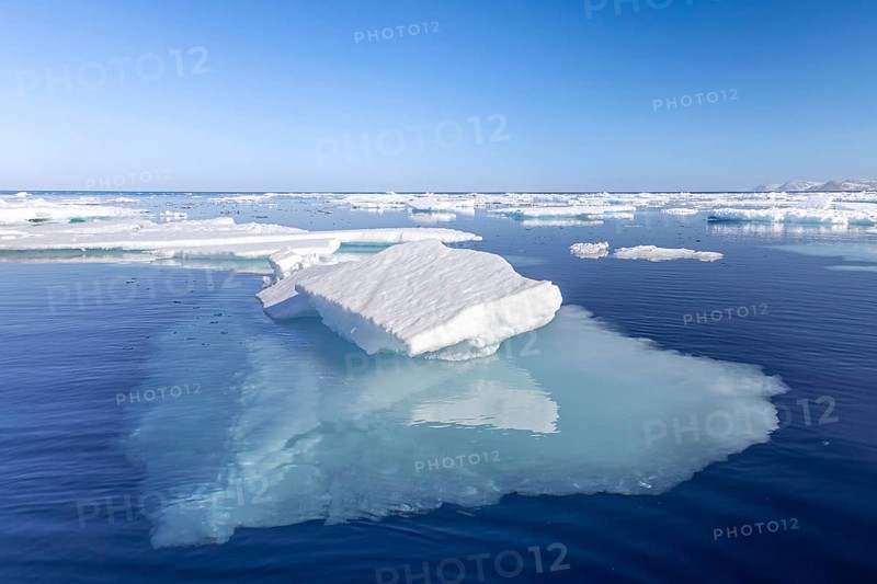 Ice floe among drift ice showing underwater much larger underside in clear sea water of the Arctic Ocean, Spitsbergen / Svalbard, Norway