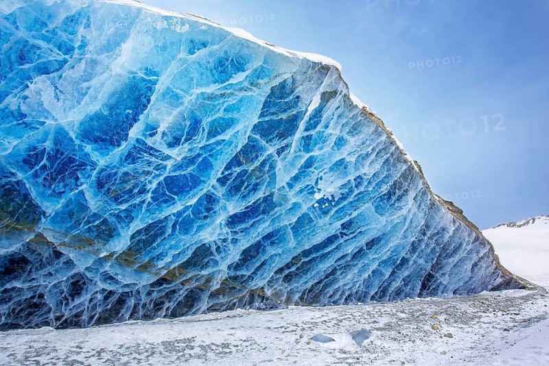 Glacier wall showing smooth melting blue ice made of compressed snow, Spitsbergen / Svalbard, Norway
