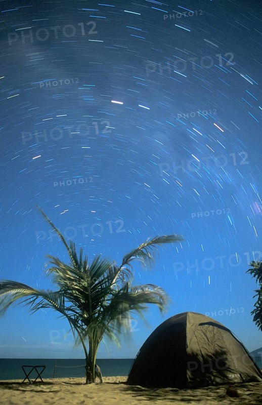 Long exposure, palm tree, tent, beach, starry sky at Kande Beach on Lake Malawi, Malawi, Africa, July 2000, vintage, retro, old, historic