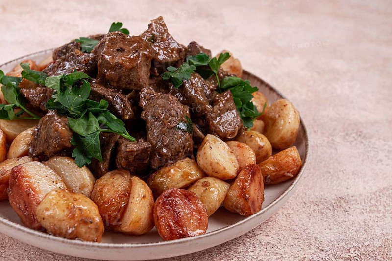 Kuyrdak, roast offal with potatoes and fresh herbs, homemade in Kazakh, no people