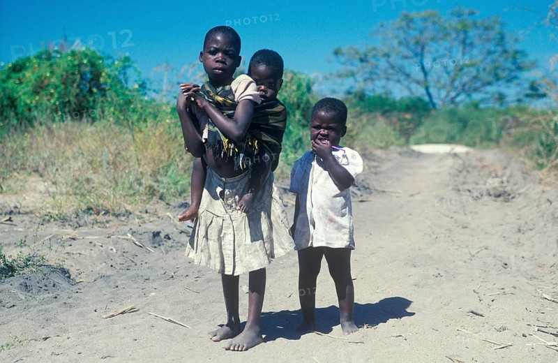 Girl with younger siblings near Kande Beach, Malawi, Africa, July 2000, vintage, retro, old, historic