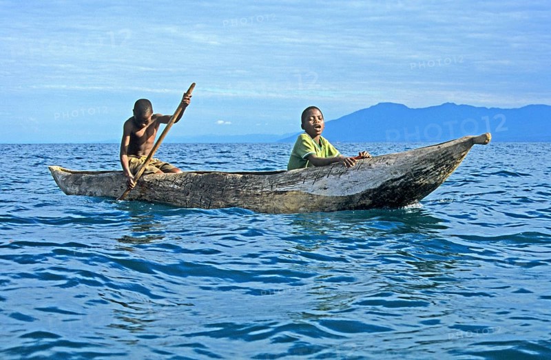 Two boys in a dugout on Lake Malawi, Malawi, Africa, July 2000, vintage, retro, old, historic