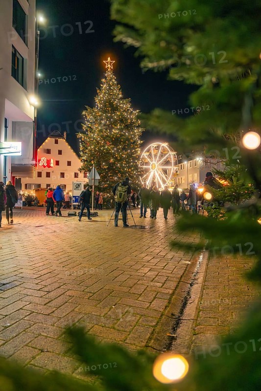 Glowing Christmas tree and Ferris wheel frame a square at night, Christmas market 2025, Nagold, Black Forest, Calw district, Germany