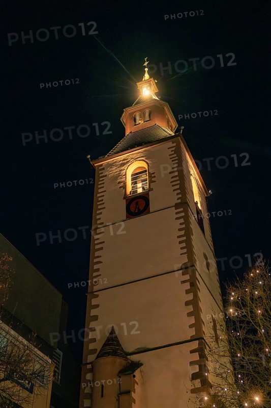 Historic church tower brightly lit at night, Christmas market 2025, Nagold, Black Forest, Calw district, Germany