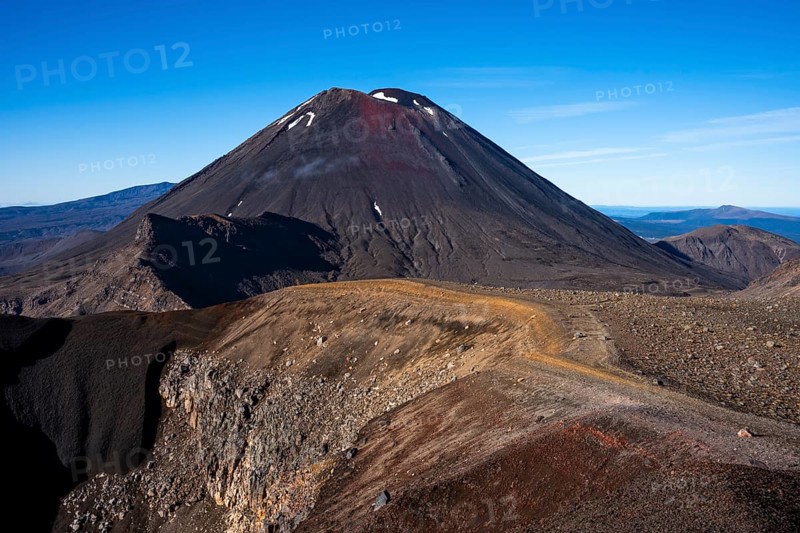 Mount Ngauruhoe and the Tongariro Alpine Crossing hiking trail in Tongariro National Park. North Island, New Zealand