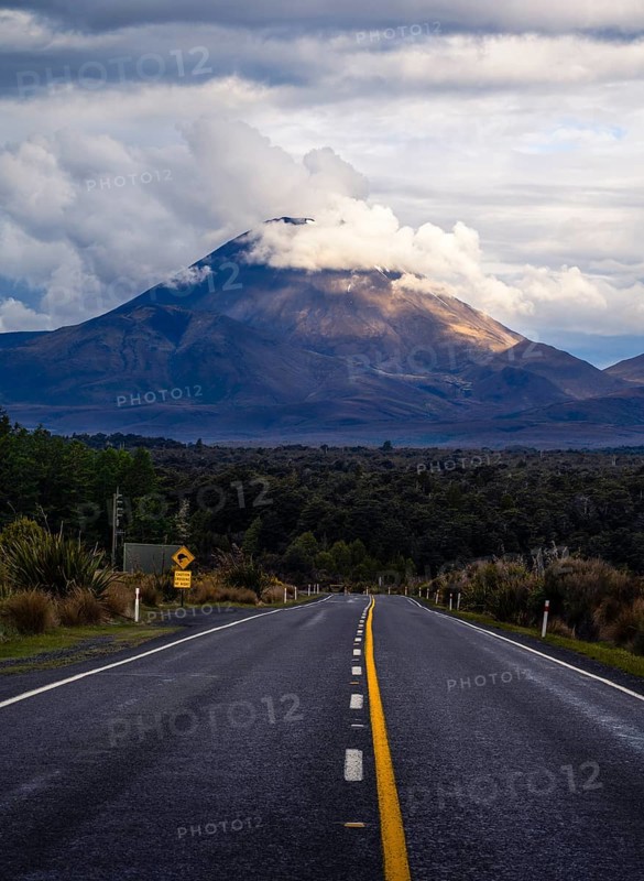 Roadshot, Mount Ngauruhoe evening at sunset, road SH 47. Tongariro National Park, North Island, New Zealand