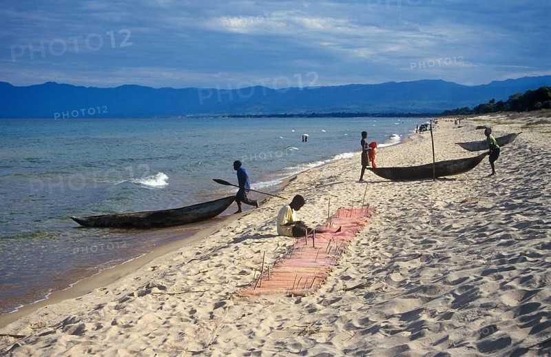 Dugout trees, fishermen at Kande Beach on Lake Malawi, Malawi, Africa, July 2000, vintage, retro, old, historic