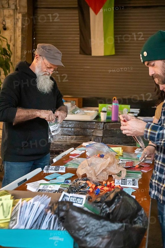 Detroit, Michigan - Volunteers with the Detroit Peoples Assembly put together whistle kits. The whistles are designed to alert others in the community when immigration agents are nearby