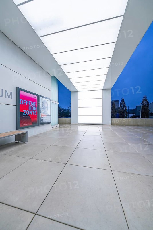 Modern museum entrance with blue lighting and large windows in the evening, Open Horizons exhibition, Schauwerk Sindelfingen, Böblingen district, Germany