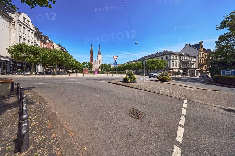 Pedestrian crossing, barrier bollard, traffic island, general architecture, St. Boniface Catholic Church, buildings, houses, roads, trees, blue sky, cirrus clouds, intersection of RheinstraÃŸe, AdolfstraÃŸe and Luisenplatz, Wiesbaden, state capital, district-free city, Hesse, Germany