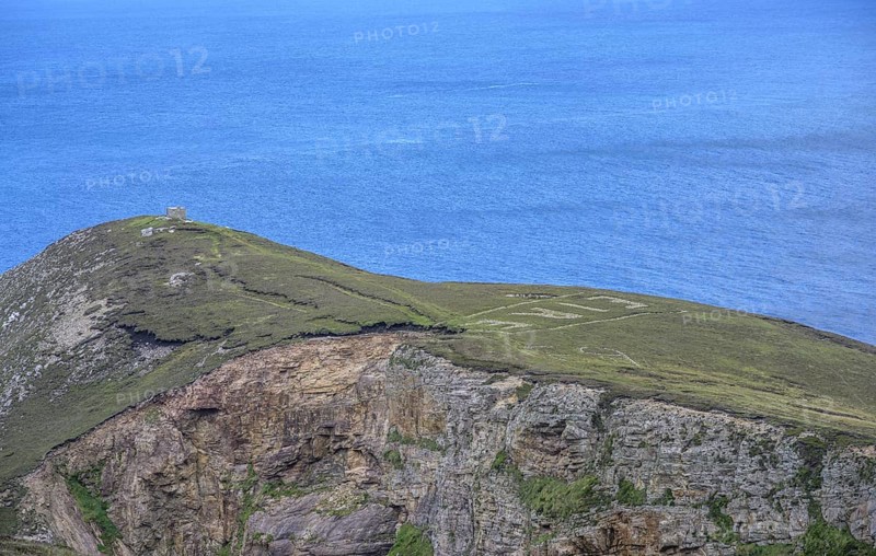 Eire sign from World War II, Portacloy loop cliff walk, Muingnabo, County Mayo, Ireland
