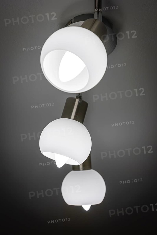 Modern ceiling lamp with three white, bowl-shaped lights