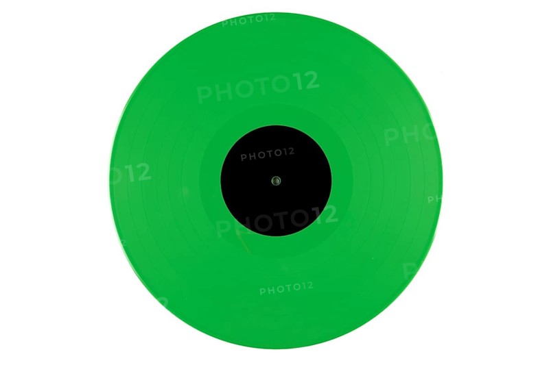 Green vinyl record with a black label in the middle on a white background