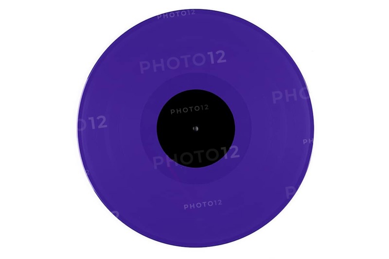 Purple vinyl record with a black label in the middle on a white background