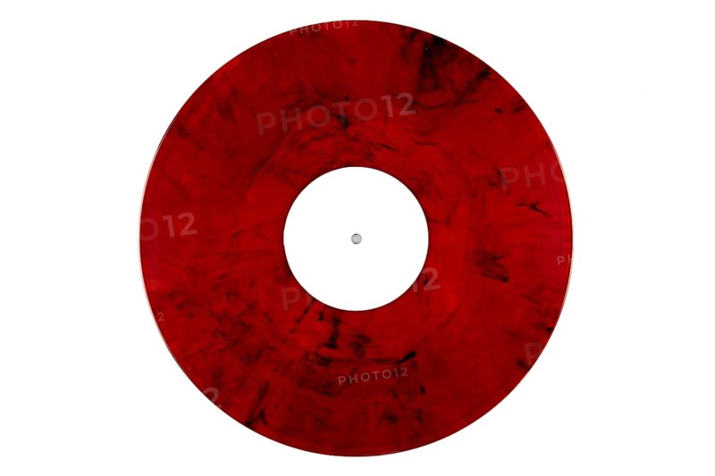 Red marbled vinyl record with a white label in the middle on a white background