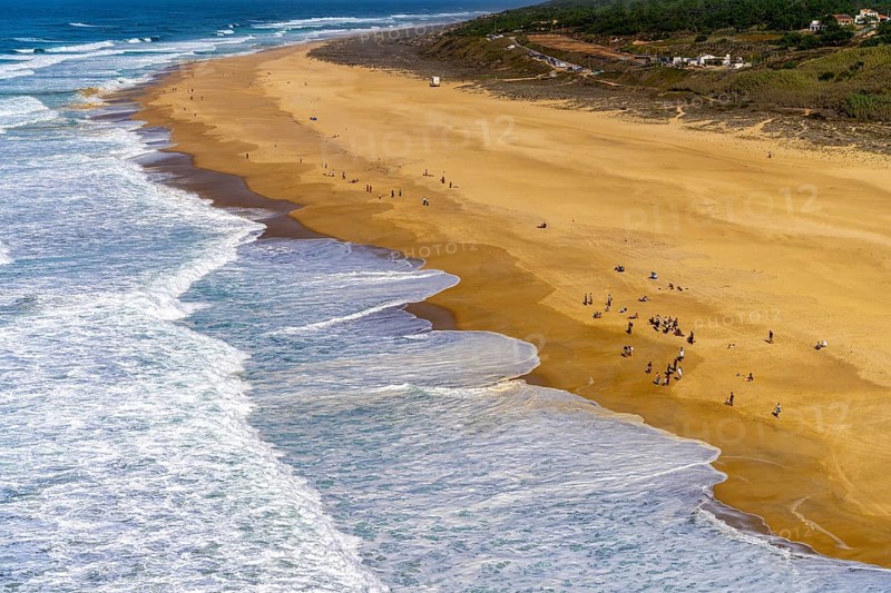 View of the extensive beach from the platform at Farol de Nazare, Portugal