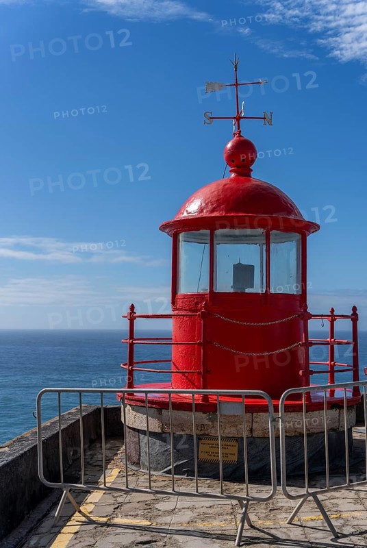 The Farol de Nazare lighthouse, an annual meeting point in autumn to watch the big waves on the North Beach, Nazaré, Portugal