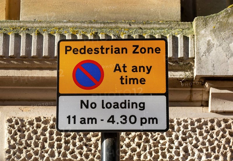 Pedestrian Zone access and loading restrictions sign in town centre of Ipswich, Suffolk, England, UK