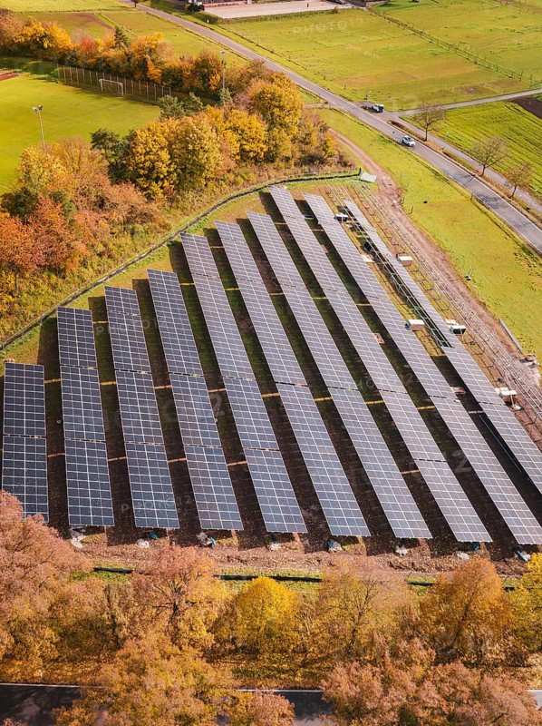 Large areas of installed solar panels surrounded by autumnal landscapes, construction of a PV open-air system, Weil der Stadt, Germany