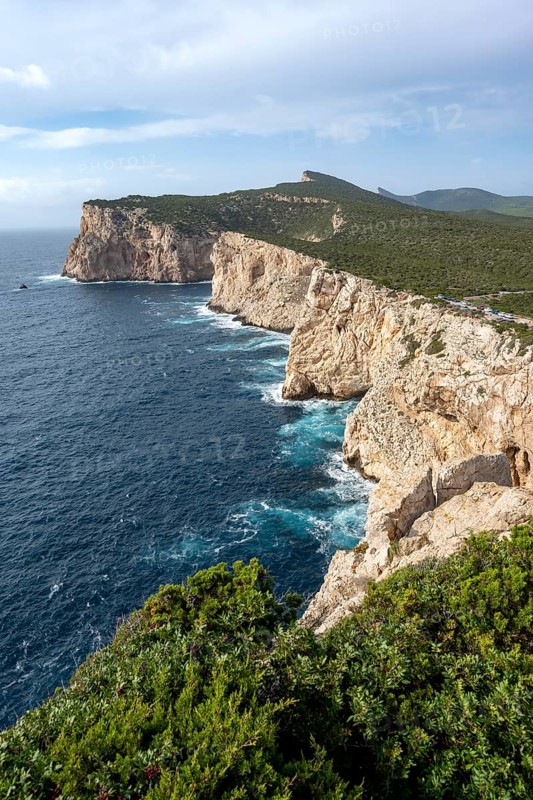 View of steep cliffs by the sea, coastal landscape, cliffs on the Capo Caccia headland, Alghero, Sardinia, Italy
