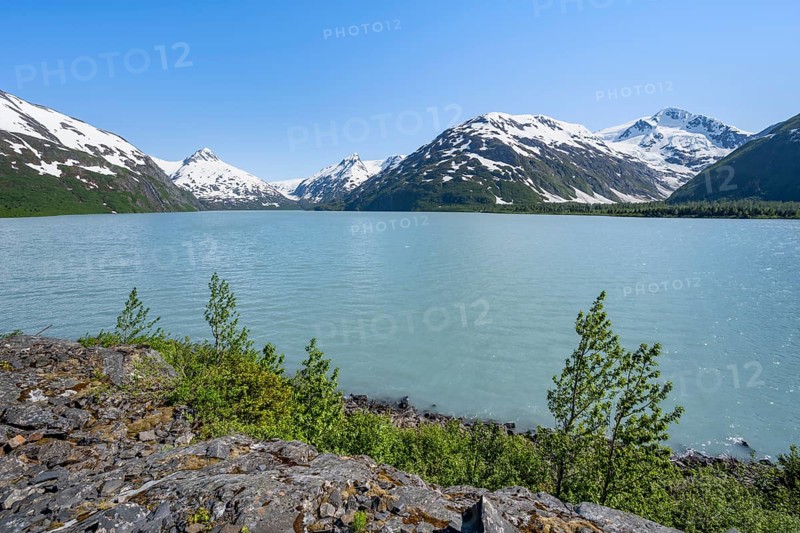 View of mountains with Portage Glacier glacier and turquoise glacial lake Portage Lake, Chugach National Forest, Alaska, USA