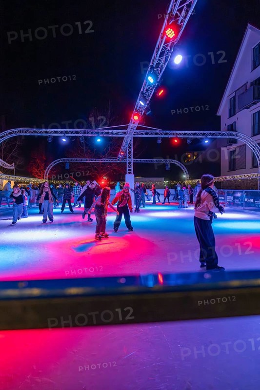 Colourful lights on an ice rink at night, people skating and friendly togetherness, Christmas market 2025, Nagold, Black Forest, Calw district, Germany