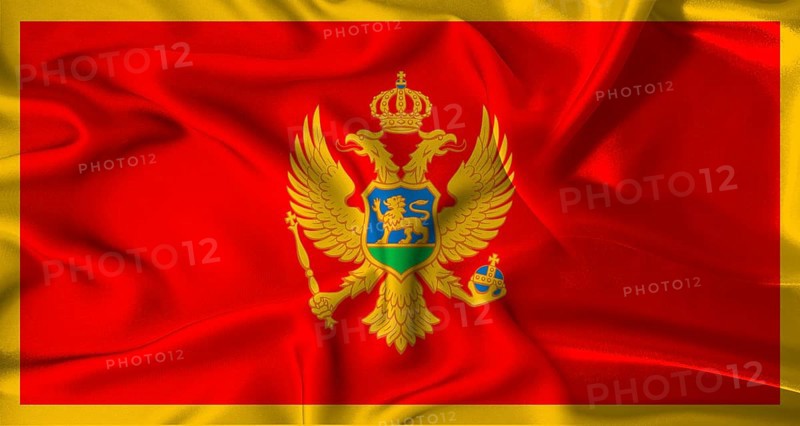 Realistic Montenegro flag waving. Close up of flag of Montenegro with cloth texture