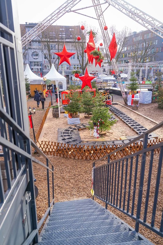 View from above of a Christmas market with a toy train and big red stars, Sindelfingen, Böblingen district, Germany