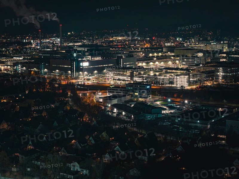 Industrial nocturnal cityscape with glowing buildings and factories, Sindelfingen, Böblingen district, Germany