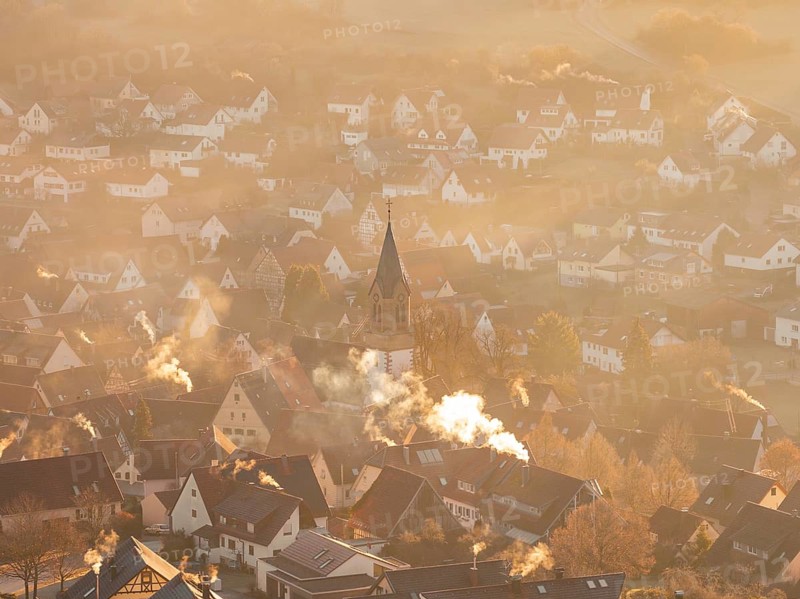 Aerial view of a village at dawn with smoke from chimneys, Gechingen, Hecken and GÃ¤u region, Calw district, Germany