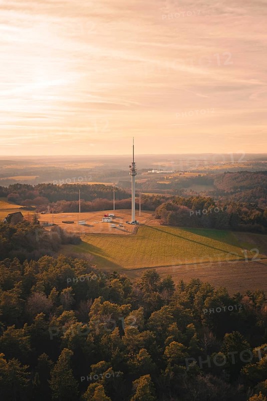 Radio mast overlooking a vast and quiet landscape, in soft evening light, Gechingen, Hecken and GÃ¤u region, Calw district, Germany