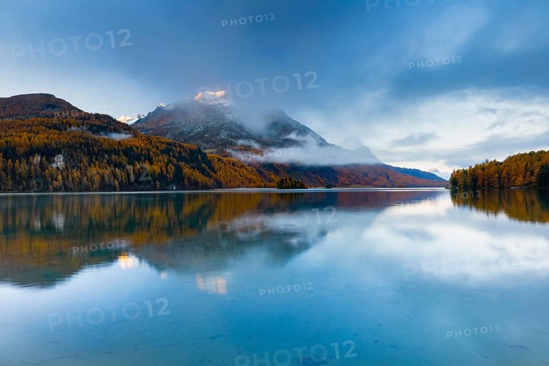 Clouds of fog over Lake Sils with Piz da la Margna in the background, Upper Engadin, Canton of GraubÃ¼nden, Switzerland