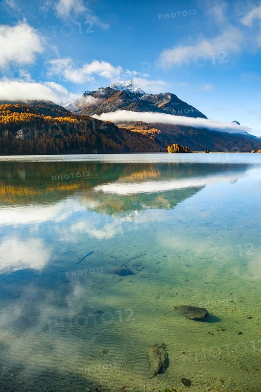 Clouds of fog over Lake Sils with Piz da la Margna in the background, Upper Engadin, Canton of GraubÃ¼nden, Switzerland