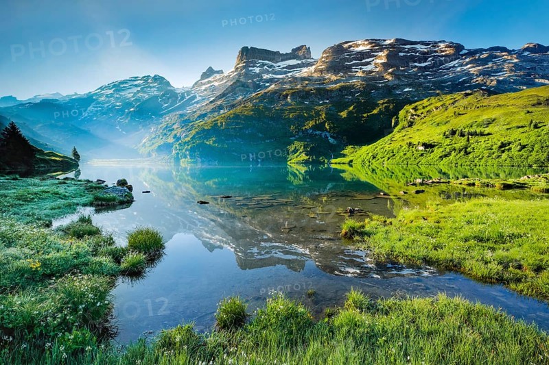 Engstlensee near Engstlenalp with GroÃŸ Wendenstock, Reissend Nollen and Titlis in the background, Canton of Bern, Switzerland