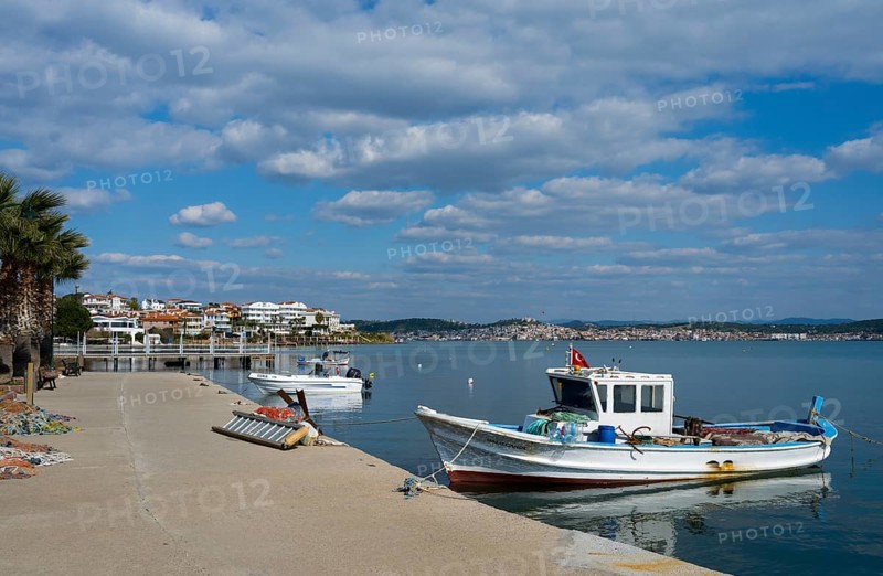 Two fishing boats in calm water near a concrete pier under cloudy sky, Alibey, Alibey Adasi Island, Cunda Adasi, Ayvalik Islands, Ayvalik, Aegean Sea, Turkey