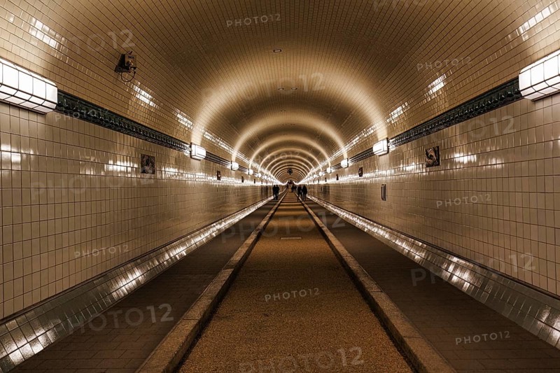 Pedestrians in the historic tunnel tube, Old Elbe Tunnel, symmetrically illuminated, tiled, Sankt Pauli, Hamburg, Germany