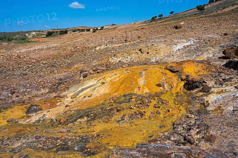 Area with yellow and brown rock formations under blue sky, geothermal area, rainbow rocks Tuzla, AyvacÄ±k, Ayvacik, Ã‡anakkale, Canakkale, Turkey