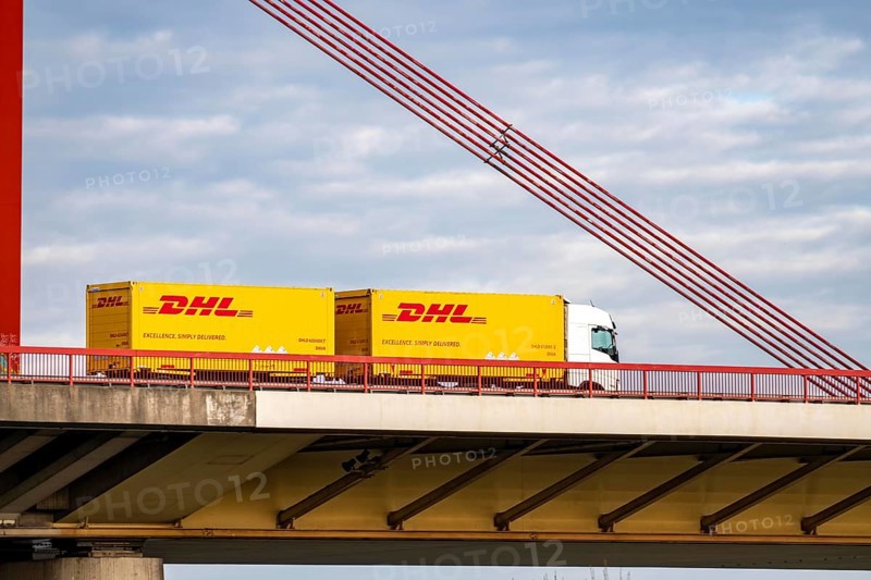 Truck, truck with trailer, from the logistics company DHL, courier companies, parcel deliveries, A42 bridge across the Rhine near Duisburg-Beeckerwerth