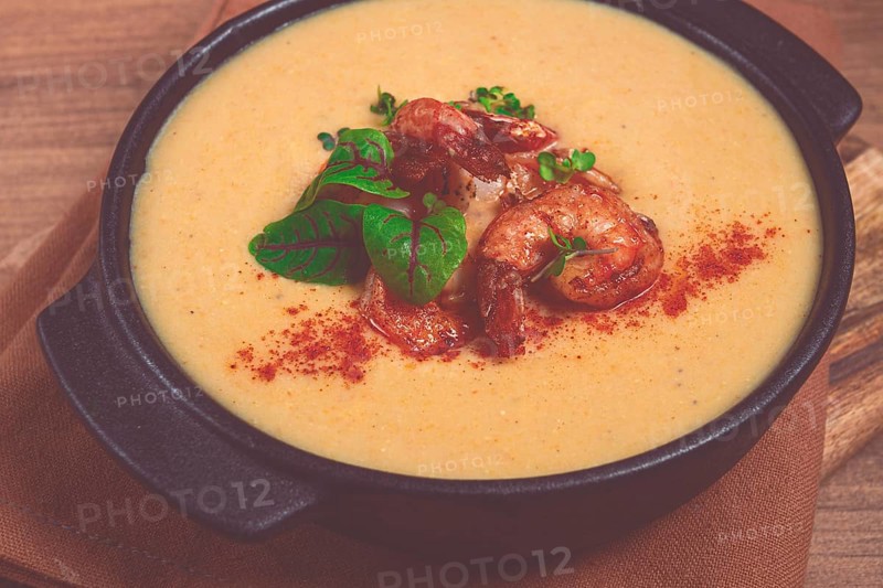 Pumpkin cream soup with shrimp, herbs and spices, homemade, no people