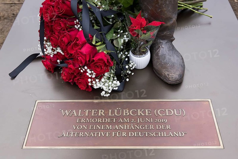 Red roses with a mourning ribbon lie on the Walter LÃ¼bcke memorial during the erection of Walter LÃ¼bcke Platz in front of the Konrad Adenauer Haus, the party headquarters of the Christian Democratic Union (CDU) on 2 December 2025. The square was erected by the Centre for Political Beauty (ZPS) and approved by the Berlin Mitte district authority for two years. Walter LÃ¼bcke was a member of the Hessian state parliament for the CDU and was murdered by an AfD supporter on 2 June 2019