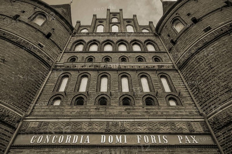 Concodia Domini Fotris Pax: The harmony of the Lord, the peace of the father, a saying at the Holsten Gate, historic city gate from 1478, sepia, Holstentorplatz, Hanseatic City of LÃ¼beck, Schleswig-Holstein, Germany