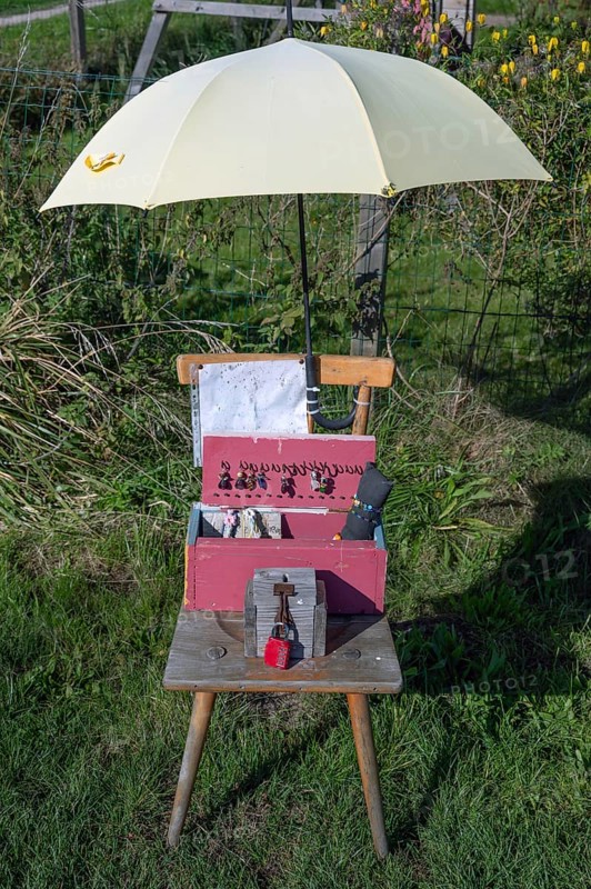 Jewellery offering under an umbrella by the wayside, Ahrenshoop, DarÃŸ, Mecklenburg-Western Pomerania, Germany