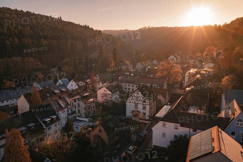 Picture of a village in a soft evening mood surrounded by hills and setting sun, Dillweisenstein, Pforzheim, Germany